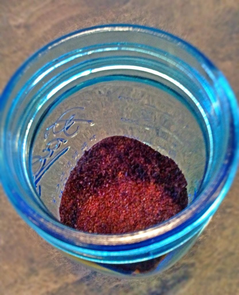 mason jar with coffee grounds at the bottom