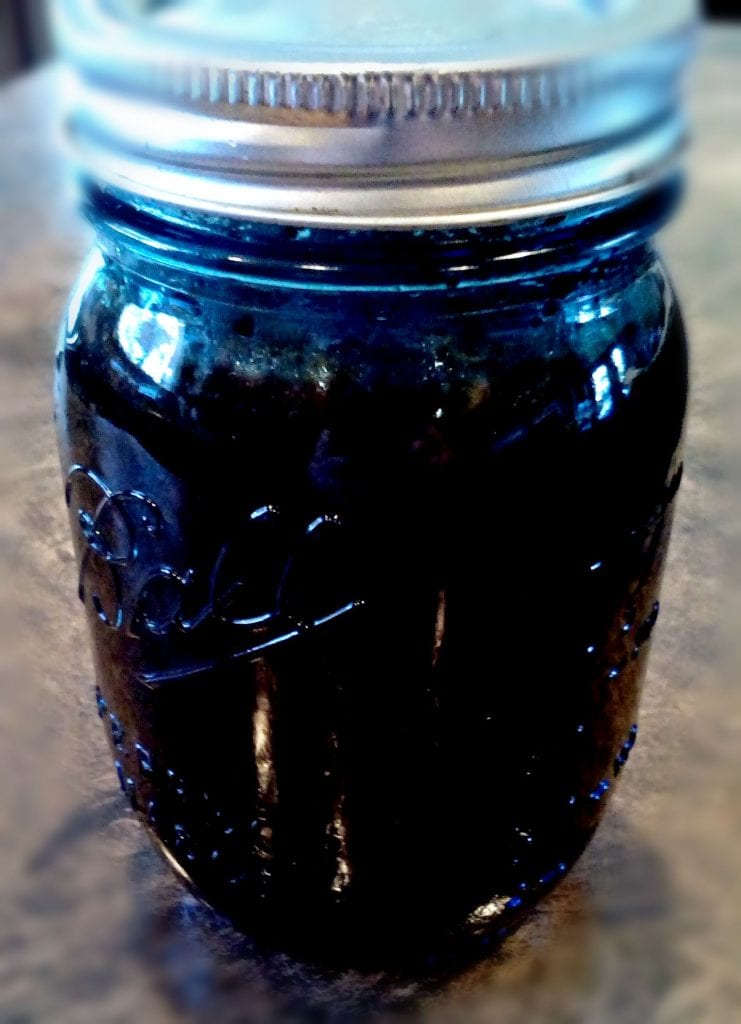 mason jar and lid filled with cold brew coffee