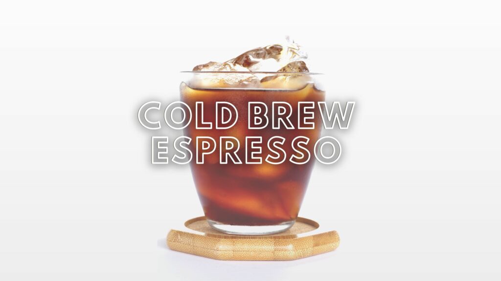 glass of cold brew espresso on a coaster with ice